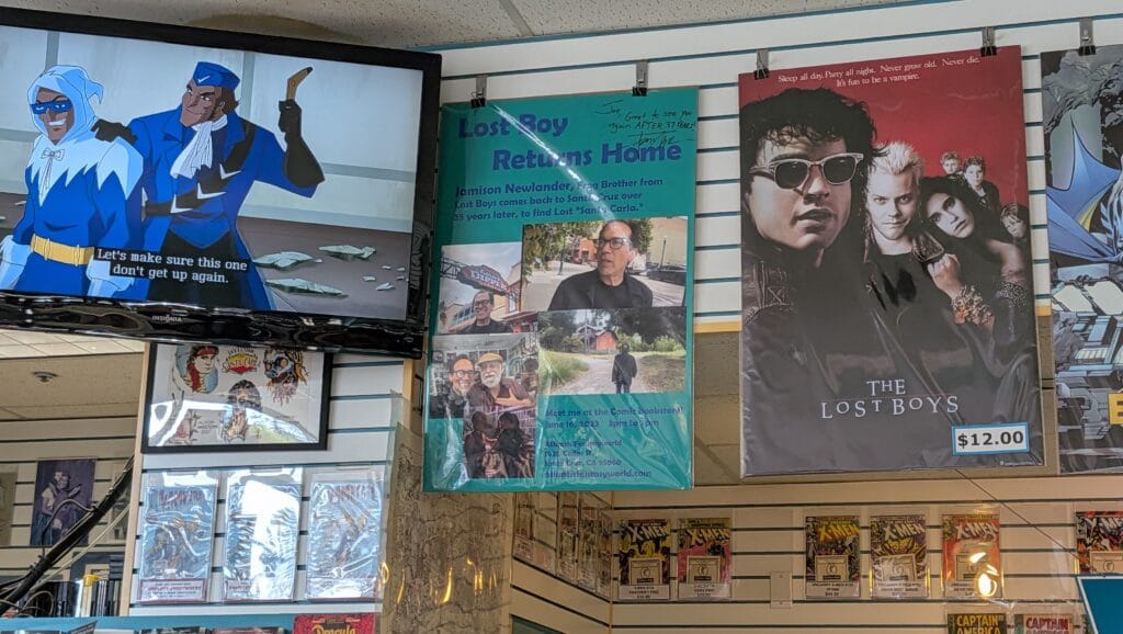 PXL_20260326_224944947.TS-000 Inside view of comic book store displaying movie posters